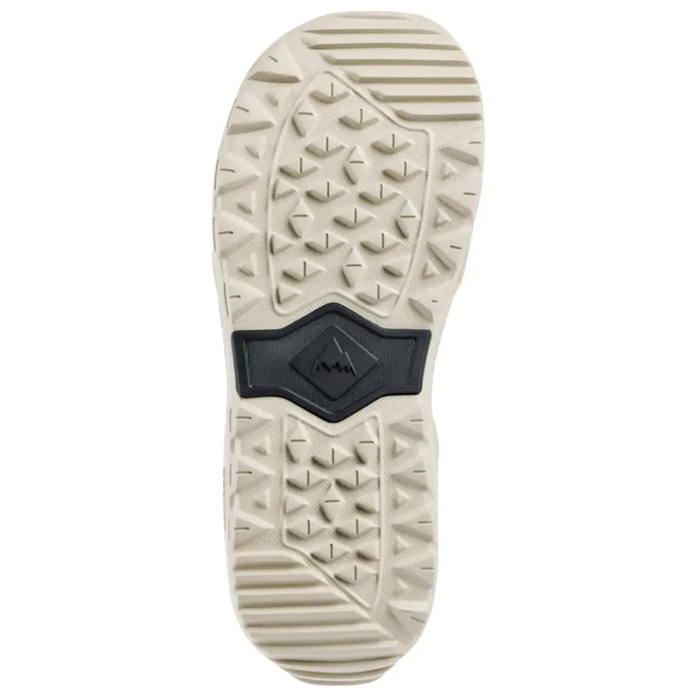 Semelle extérieure blanche vue dessous, avec crampons multidirectionnels et insert central noir portant le logo Burton