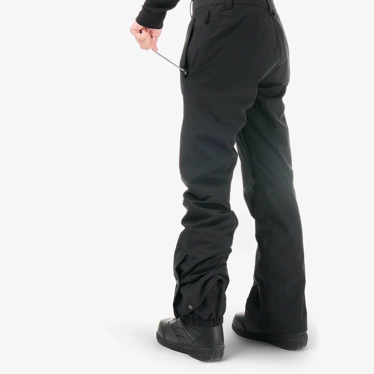 Profil trois-quarts du pantalon de ski femme Picture Exa Black, volume au niveau des jambes et coupe technique