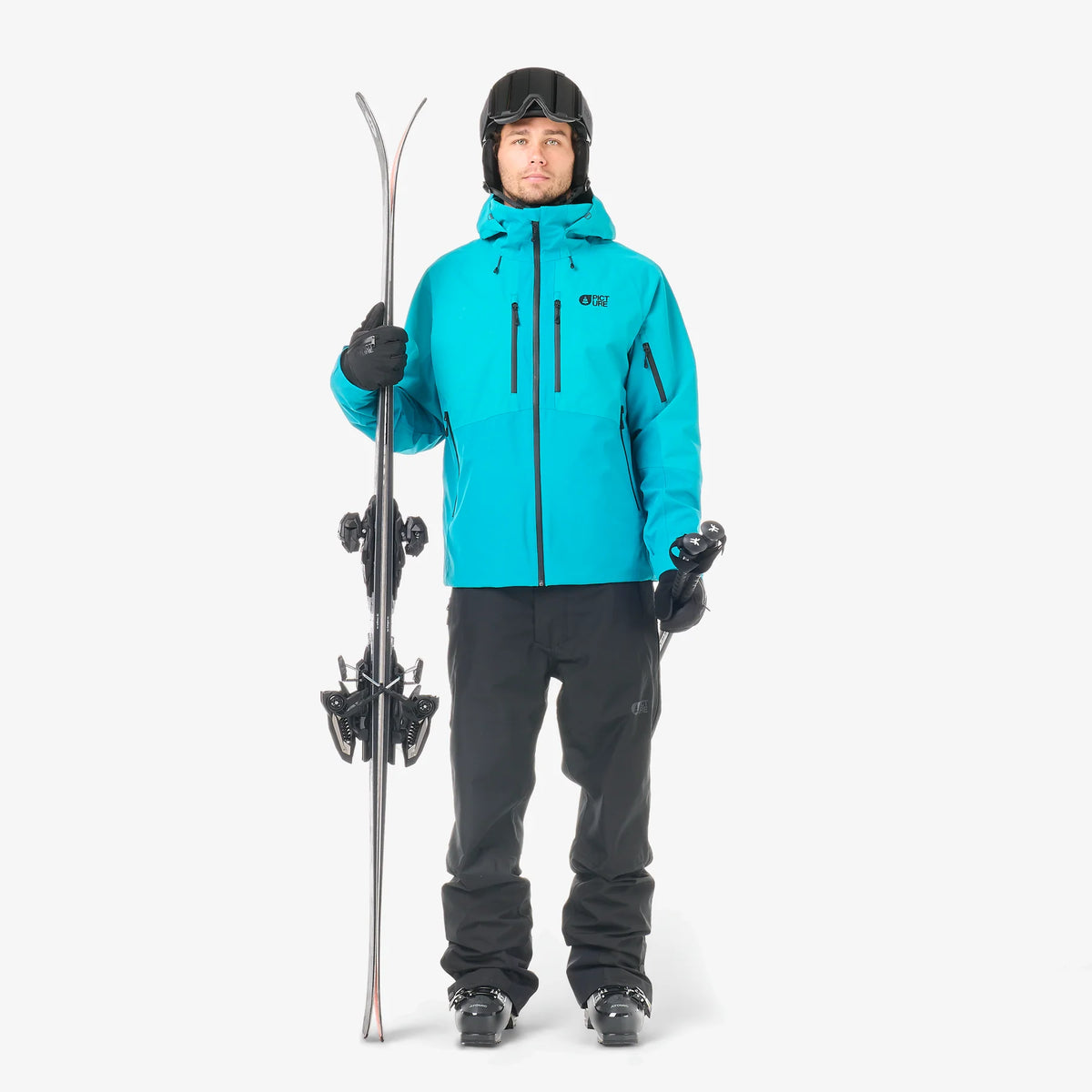 Tenue de ski homme avec veste Picture Goods JKT Capri Breeze portée de face, pantalon noir et coupe technique