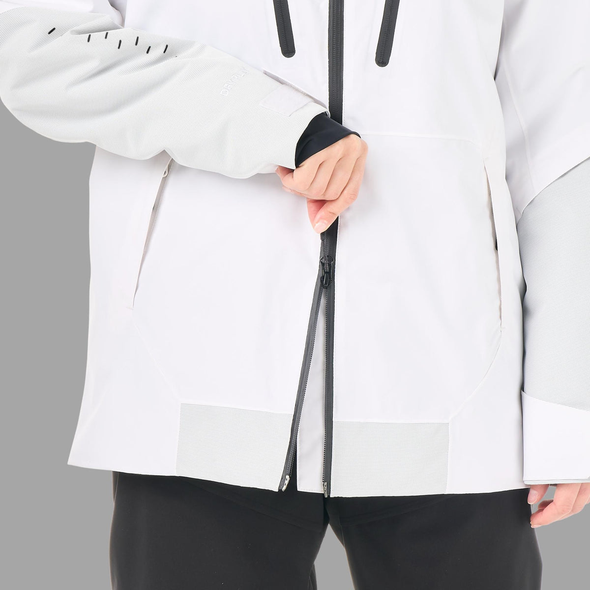 Zip frontal à double sens de la veste Picture Orakoon JKT Brillant White, détail de l’ouverture par le bas