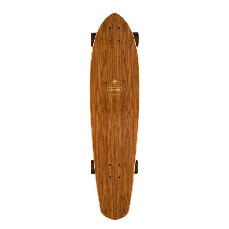 Vue du dessus du plateau en bois brun veiné du longboard Arbor Mission, forme allongée aux extrémités arrondies.