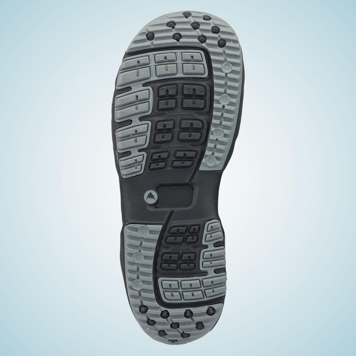 Semelle extérieure de la boot Burton vue dessous, avec larges blocs de traction gris et noirs répartis du talon aux orteils
