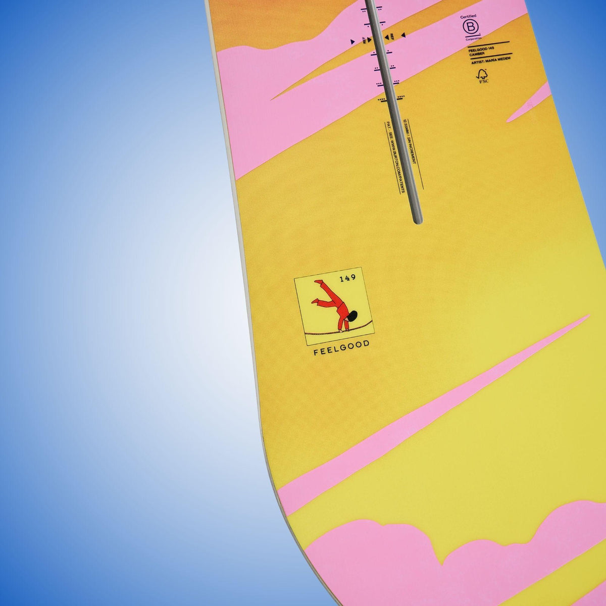 Détail du talon jaune et rose de la Feelgood Camber, avec repères techniques, ligne centrale noire et petit logo