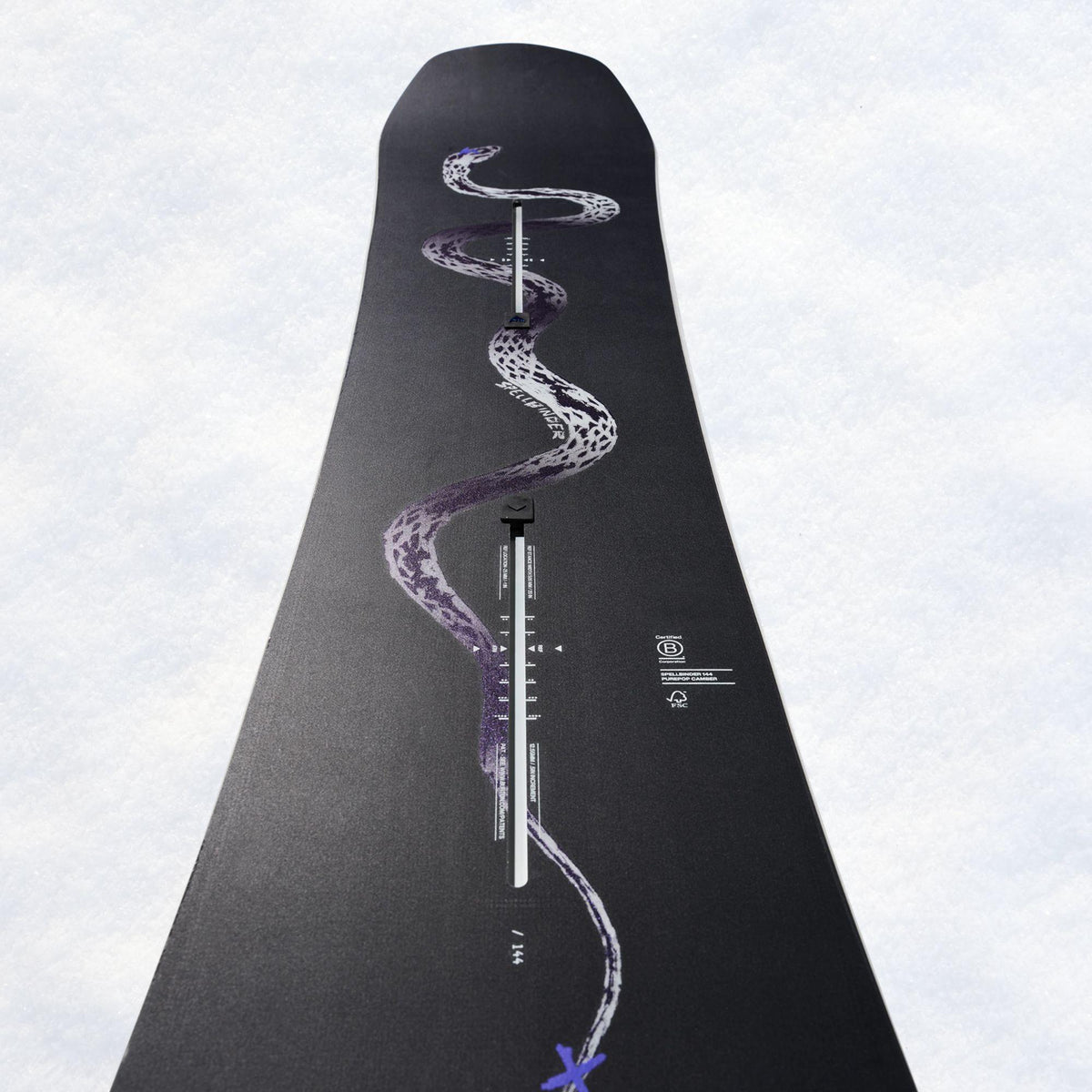 Partie centrale de la board Burton, illustration serpentine violette traversant la zone de montage des fixations