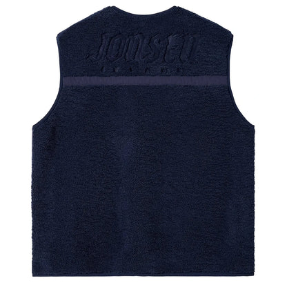 Dos du gilet bleu marine, empiècement supérieur contrasté par un large marquage ton sur ton aux épaules