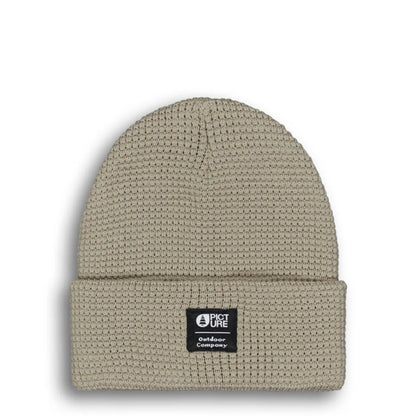 Picture York Beanie Pure Cashmere présenté seul de face, maille gaufrée beige et étiquette Picture sur le revers