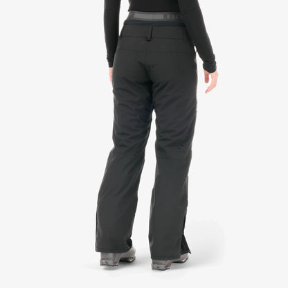 Vue arrière du pantalon Picture Treva Black porté avec boots de neige, jambes droites et coupe technique