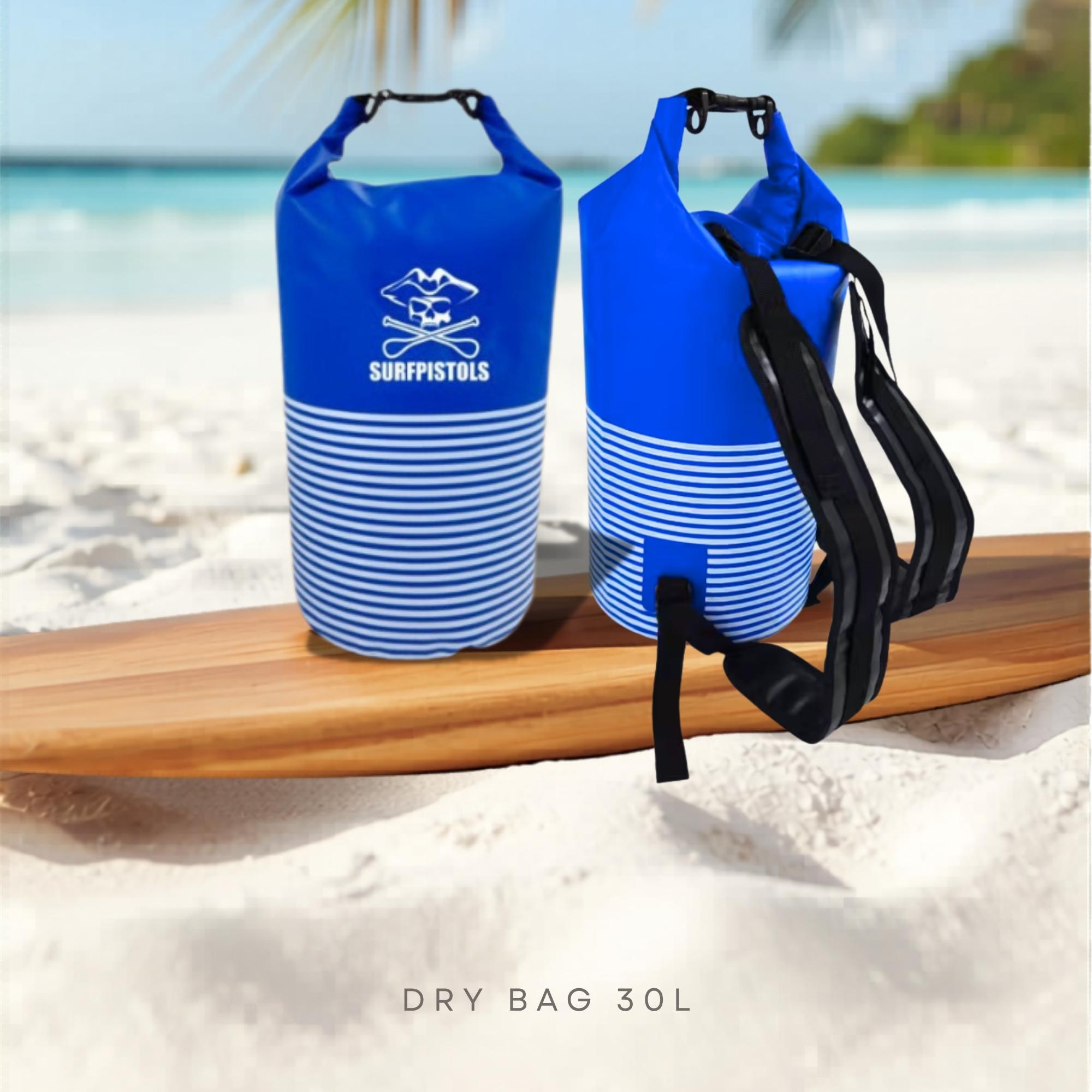 Sac étanche Surfpistols 30L bleusur planche de surf paddle à la plage