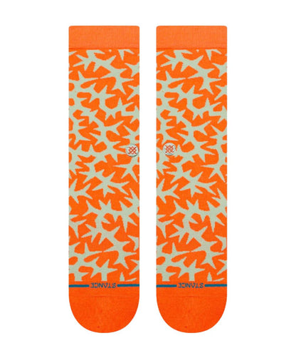 Vue à plat des chaussettes Stance Thornz crew avec motif graphique intégral orange