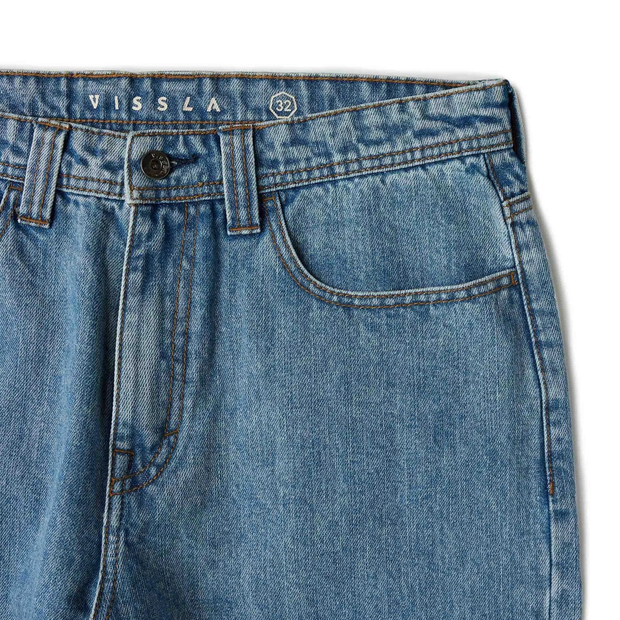 jean large homme bleu détail coutures et poches avant